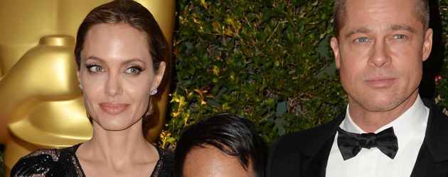 Angelina Jolie und Brad Pitt mit Sohn Maddox im Jahr 2013 Angelina Jolie und Brad Pitt mit Sohn Maddox im Jahr 2013