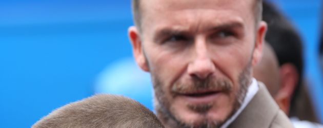 David Beckham und Romeo im Tennis-Stadion David Beckham und Romeo im Tennis-Stadion
